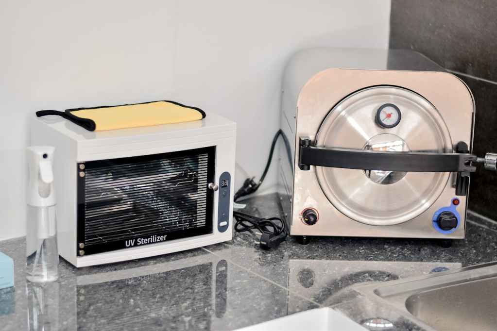 autoclave machine and UV sterilizer on a countertop